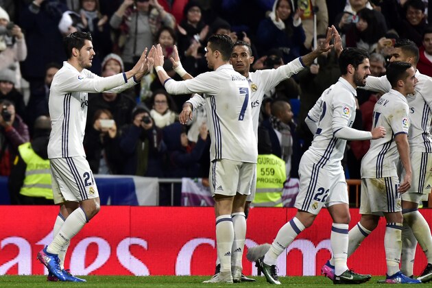 Real Madrid's forward Alvaro Morata is congratulated by Real Madrid's Portuguese forward Cristiano Ronaldo (2L) after scoring a goal during the Spanish league football match Real Madrid CF vs Real Sociedad at the Santiago Bernabeu stadium in Madrid on January 29, 2017. / AFP / GERARD JULIEN        (Photo credit should read GERARD JULIEN/AFP/Getty Images)