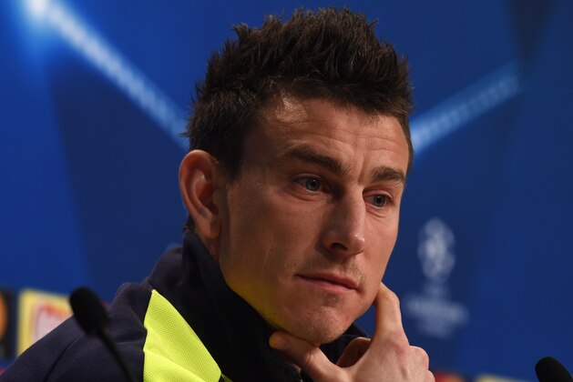 Arsenal London's French defender Laurent Koscielny looks on during the press conference at the stadium in Munich, southern Germany, on February 14, 2017, on the eve of the UEFA Champions League round of sixteen match between FC Bayern Munich and Arsenal London.  / AFP / Christof STACHE        (Photo credit should read CHRISTOF STACHE/AFP/Getty Images)