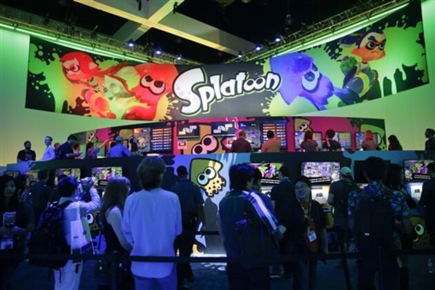 People wait in line to play the