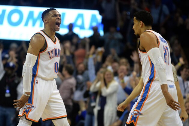 Feb 15, 2017; Oklahoma City, OK, USA; Oklahoma City Thunder guard Russell Westbrook (0) and forward Andre Roberson (21) react after a play against the New York Knicks during the second quarter at Chesapeake Energy Arena. Mandatory Credit: Mark D. Smith-USA TODAY Sports