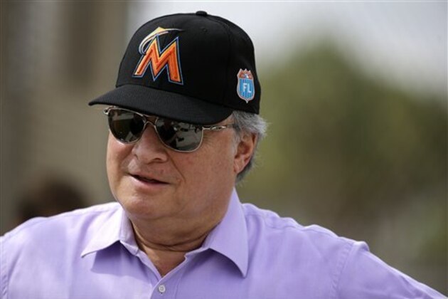 Miami Marlins owner Jeffrey Loria watches his team during spring training baseball practice Wednesday, Feb. 24, 2016, in Jupiter, Fla. (AP Photo/Jeff Roberson)