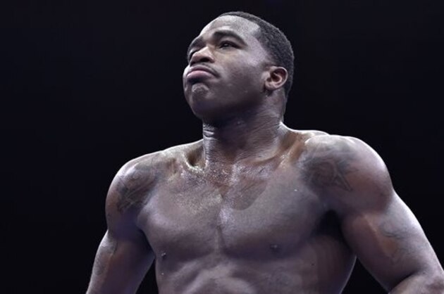 Adrien Broner walks back to his corner during his welterweight boxing bout against Shawn Porter on Saturday, June 20, 2015, in Las Vegas. Porter won by unanimous decision. (AP Photo/David Becker)