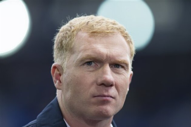 Paul Scholes as a television pundit before the English Premier League soccer match between Everton and Chelsea at Goodison Park Stadium, Liverpool, England, Saturday Sept. 12, 2015. (AP Photo/Jon Super)
