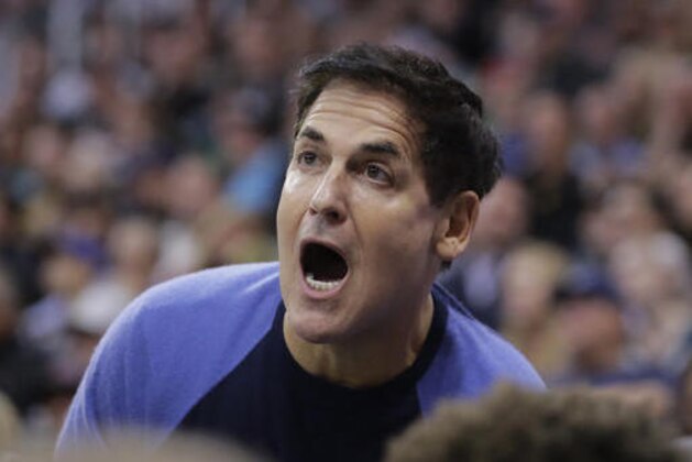 FILE - In this Dec. 16, 2016 file photo, Dallas Mavericks owner Mark Cuban shouts to his team in the first half during an NBA basketball game against the Utah Jazz  in Salt Lake City.  Cuban questioned the effectiveness of President Donald Trump's executive order restricting immigration from seven countries, citing the