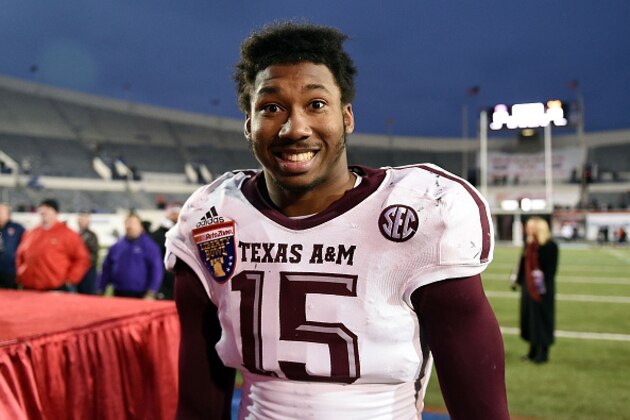 MEMPHIS, TN - DECEMBER 29:  Myles Garrett #15 of the Texas A&M Aggies leaves the field following a victory over the West Virginia Mountaineers in the 56th annual Autozone Liberty Bowl at Liberty Bowl Memorial Stadium on December 29, 2014 in Memphis, Tennessee.  Texas A&M won the game 45-37.  (Photo by Stacy Revere/Getty Images)
