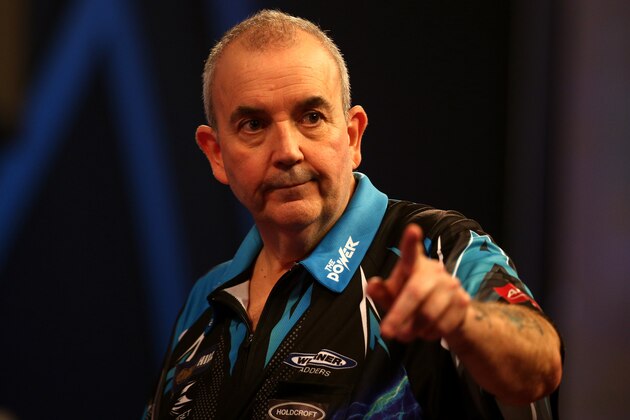 LONDON, ENGLAND - DECEMBER 18:  Phil Taylor of England celebrates victory following his first round match against David Platt of England  during Day Four of the 2017 William Hill PDC World Darts Championships  at Alexandra Palace on December 18, 2016 in London, England.  (Photo by Alex Pantling/Getty Images)