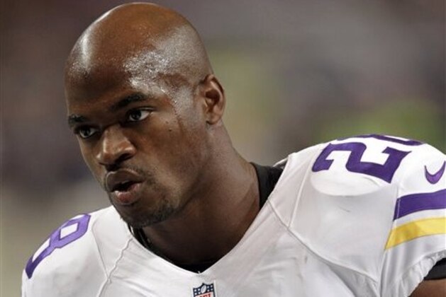 FILE - In this Sept. 7, 2014, file photo, Minnesota Vikings running back Adrian Peterson warms up before the start of an NFL football game between the St. Louis Rams and the Vikings  in St. Louis. Adrian Peterson and the Minnesota Vikings have reached a standstill in their relationship. Peterson's agent, Ben Dogra, said in an interview on Tuesday, March 24, 2015,  that he believes a return to Minnesota this season is not in the