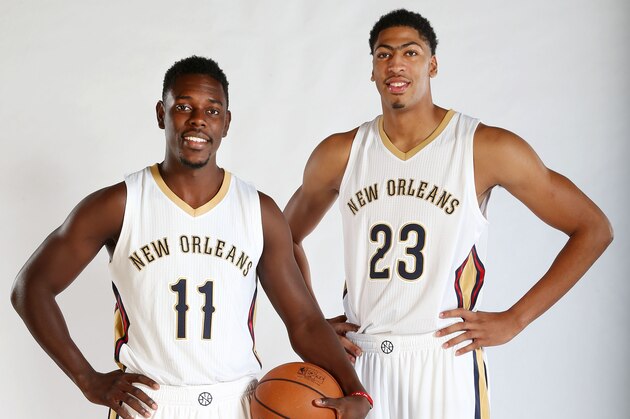 METAIRIE, LA - SEPTEMBER 29: Jrue Holiday #11 and Anthony Davis #23 of the New Orleans Pelicans pose for photos during NBA Media Day on September 29, 2014 at the New Orleans Pelicans practice facility in Metairie, Louisiana. NOTE TO USER: User expressly acknowledges and agrees that, by downloading and or using this Photograph, user is consenting to the terms and conditions of the Getty Images License Agreement. Mandatory Copyright Notice: Copyright 2014 NBAE (Photo by Layne Murdoch Jr./NBAE via Getty Images)