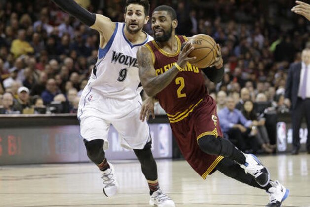 Cleveland Cavaliers' Kyrie Irving (2) drives against Minnesota Timberwolves' Ricky Rubio (9), from Spain, in the first half of an NBA basketball game, Wednesday, Feb. 1, 2017, in Cleveland. (AP Photo/Tony Dejak)
