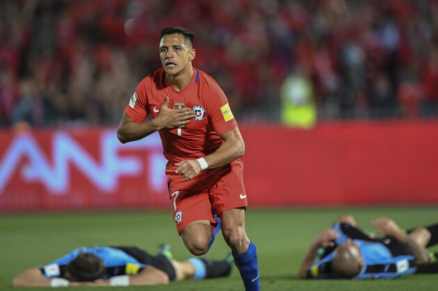 TOPSHOT - Chile's forward Alexis Sanchez celebrates after scoring against Uruguay during their 2018 FIFA World Cup qualifier football match in Santiago, on November 15, 2016. / AFP / Martin BERNETTI        (Photo credit should read MARTIN BERNETTI/AFP/Getty Images)