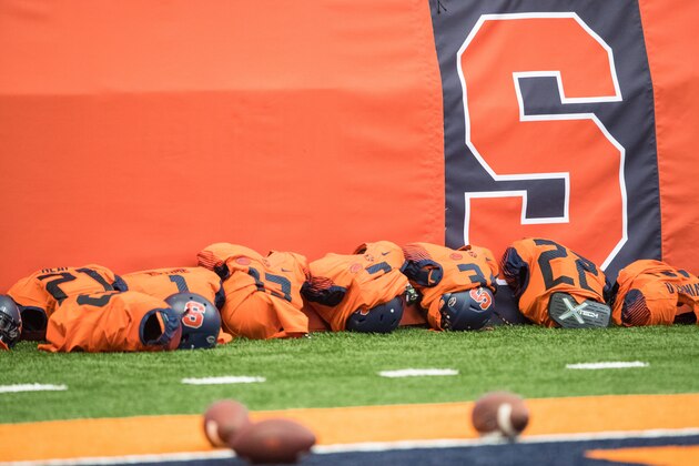 SYRACUSE, NY - SEPTEMBER 02:  Shoulder pads and helmets line the wall next to a Syracuse Orange logo before the game against the Colgate Raiders on September 2, 2016 at The Carrier Dome in Syracuse, New York. Syracuse defeats Colgate 33-7.  (Photo by Brett Carlsen/Getty Images) *** Local Caption ***