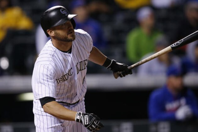 Colorado Rockies' Ryan Raburn follows the flight of his RBI-double to drive in the tying run off Chicago Cubs relief pitcher Aroldis Chapman in the 11th inning of a baseball game Friday, Aug. 19, 2016 in Denver. The Rockies won 7-6 when Raburn scored on an error by Cubs second baseman Javier Baez. (AP Photo/David Zalubowski)