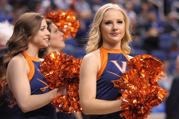 GREENSBORO, NC - MARCH 13: Cheerleaders of the Virginia Cavaliers perform against the North Carolina Tar Heels during the semifinals of the 2015 Men's ACC Tournament at the Greensboro Coliseum on March 13, 2015 in Greensboro, North Carolina. (Photo by Lance King/Getty Images)