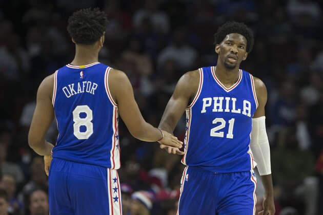 PHILADELPHIA, PA - OCTOBER 26: Jahlil Okafor #8 of the Philadelphia 76ers slaps hands with Joel Embiid #21 against the Oklahoma City Thunder at Wells Fargo Center on October 26, 2016 in Philadelphia, Pennsylvania. NOTE TO USER: User expressly acknowledges and agrees that, by downloading and or using this photograph, User is consenting to the terms and conditions of the Getty Images License Agreement. The Thunder defeated the 76ers 103-97. (Photo by Mitchell Leff/Getty Images)