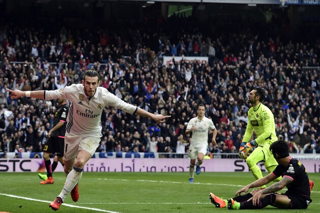 Real Madrid's Welsh forward Gareth Bale celebrates a goal during the Spanish league football match Real Madrid CF vs RCD Espanyol at the Santiago Bernabeu stadium in Madrid on February 18, 2017. / AFP / JAVIER SORIANO        (Photo credit should read JAVIER SORIANO/AFP/Getty Images)
