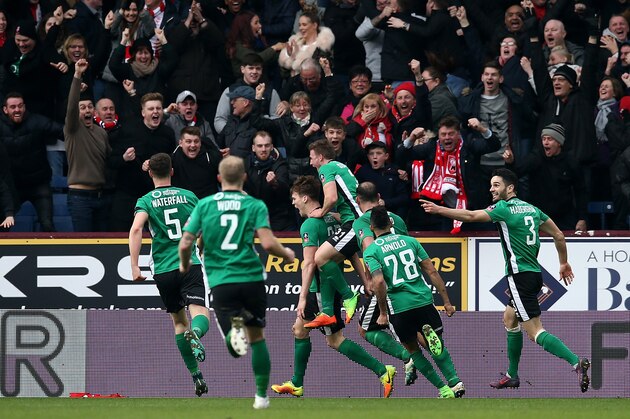 BURNLEY, ENGLAND - FEBRUARY 18:  Sean Raggett of Lincoln City (C) celebrates scoring his sides first goal with his Lincoln City team mates during The Emirates FA Cup Fifth Round match between Burnley and Lincoln City at Turf Moor on February 18, 2017 in Burnley, England.  (Photo by Jan Kruger/Getty Images)