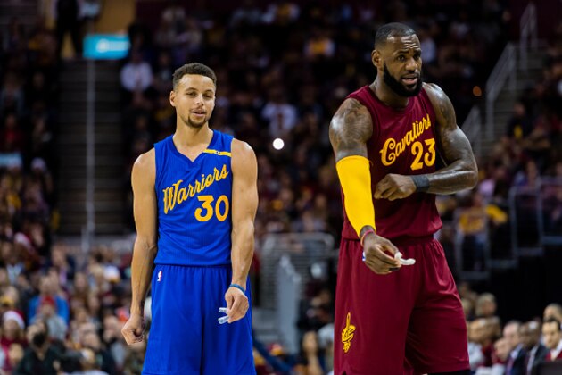 CLEVELAND, OH - DECEMBER 25: Stephen Curry #30 of the Golden State Warriors and LeBron James #23 of the Cleveland Cavaliers pause on the court during the first half at Quicken Loans Arena on December 25, 2016 in Cleveland, Ohio. NOTE TO USER: User expressly acknowledges and agrees that, by downloading and/or using this photograph, user is consenting to the terms and conditions of the Getty Images License Agreement. Mandatory copyright notice. (Photo by Jason Miller/Getty Images)
