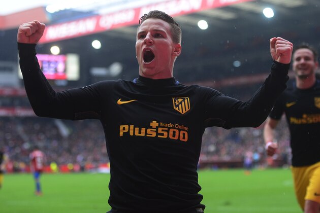 Atletico Madrid's French forward Kevin Gameiro celebrates after scoring a goal during the Spanish league football match Real Sporting de Gijon vs Club Atletico de Madrid at El Molinon stadium in Gijon on February 18, 2017. / AFP / MIGUEL RIOPA        (Photo credit should read MIGUEL RIOPA/AFP/Getty Images)
