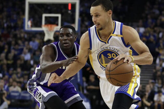Golden State Warriors' Stephen Curry, right, drives the ball against Sacramento Kings' Darren Collison during the first half of an NBA basketball game Wednesday, Feb. 15, 2017, in Oakland, Calif. (AP Photo/Ben Margot)