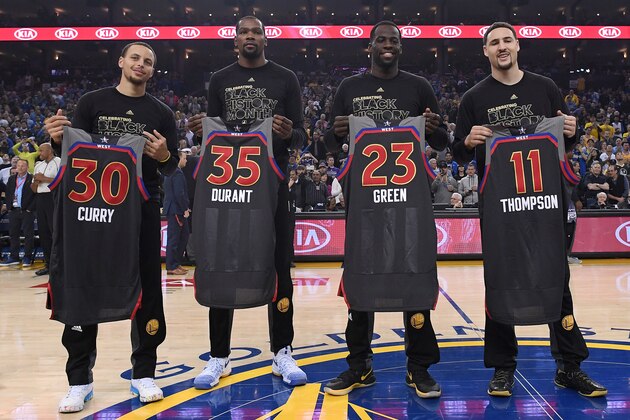OAKLAND, CA - FEBRUARY 15:  (L-R) Stephen Curry #30, Kevin Durant #35, Draymond Green #23 and Klay Thompson #11 of the Golden State Warriors display the AllStar Jerseys prior to the start of an NBA Basketball game against the Sacramento Kings at ORACLE Arena on February 15, 2017 in Oakland, California. NOTE TO USER: User expressly acknowledges and agrees that, by downloading and or using this photograph, User is consenting to the terms and conditions of the Getty Images License Agreement.  (Photo by Thearon W. Henderson/Getty Images)