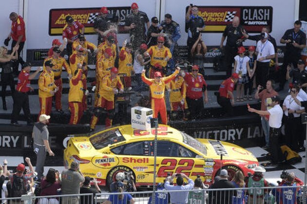 Joey Logano (22) celebrates in Victory Lane after winning a NASCAR Clash auto race at Daytona International Speedway in Daytona Beach, Fla., Sunday, Feb. 19, 2017. (AP Photo/Phelan M. Ebenhack)