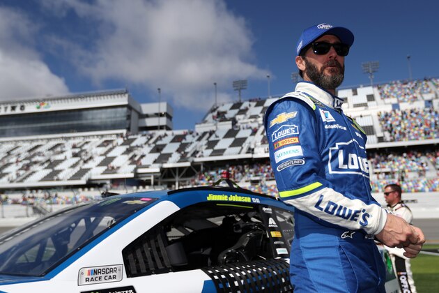 DAYTONA BEACH, FL - FEBRUARY 19:  Jimmie Johnson, driver of the #48 Lowe's Chevrolet, stands on the grid during pre-race ceremonies for the weather delayed Monster Energy NASCAR Cup Series Advance Auto Parts Clash at Daytona International Speedway on February 19, 2017 in Daytona Beach, Florida.  (Photo by Chris Graythen/Getty Images)
