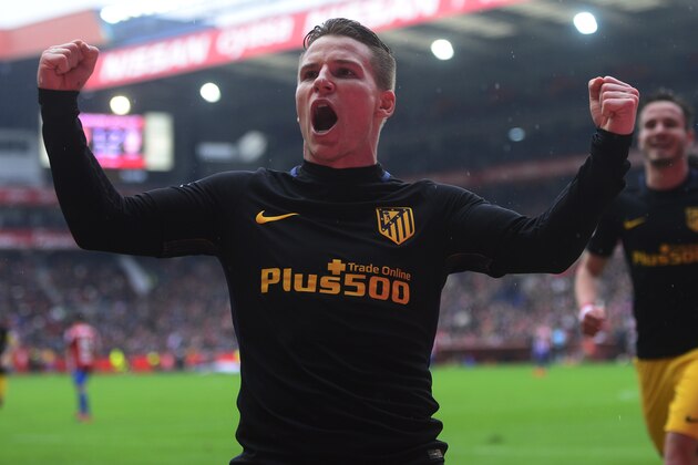 Atletico Madrid's French forward Kevin Gameiro celebrates after scoring a goal during the Spanish league football match Real Sporting de Gijon vs Club Atletico de Madrid at El Molinon stadium in Gijon on February 18, 2017. / AFP / MIGUEL RIOPA        (Photo credit should read MIGUEL RIOPA/AFP/Getty Images)