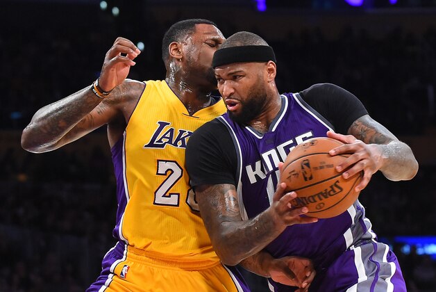 LOS ANGELES, CA - FEBRUARY 14:  DeMarcus Cousins #15 of the Sacramento Kings is fouled by Tarik Black #28 of the Los Angeles Lakers as he drives to the basket in the second half of the game at Staples Center on February 14, 2017 in Los Angeles, California. The Sacramento Kings won 97-96.NOTE TO USER: User expressly acknowledges and agrees that, by downloading and or using this photograph, User is consenting to the terms and conditions of the Getty Images License Agreement. (Photo by Jayne Kamin-Oncea/Getty Images)