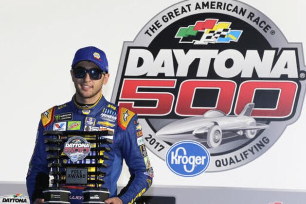 Chase Elliott holds his trophy for winning the pole position for the NASCAR Daytona 500 auto race at Daytona International Speedway, Sunday, Feb. 19, 2017, in Daytona Beach, Fla. (AP Photo/Terry Renna)