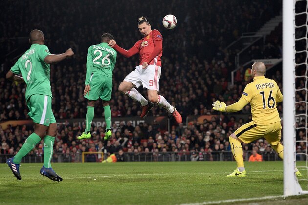 TOPSHOT - Manchester United's Swedish striker Zlatan Ibrahimovic (C) heads the ball to score but is ruled offside during the UEFA Europa League Round of 32 first-leg football match between Manchester United and Saint-Etienne at Old Trafford stadium in Manchester, north-west England, on February 16, 2017. / AFP / Oli SCARFF        (Photo credit should read OLI SCARFF/AFP/Getty Images)