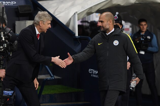 MANCHESTER, ENGLAND - DECEMBER 18:  Arsene Wenger, Manager of Arsenal (L) and Josep Guardiola, Manager of Manchester City (R) shake hands prior to kick off during the Premier League match between Manchester City and Arsenal at the Etihad Stadium on December 18, 2016 in Manchester, England.  (Photo by Michael Regan/Getty Images)