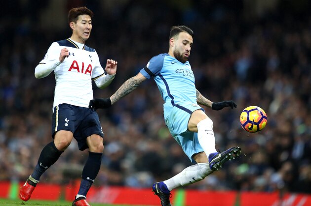 MANCHESTER, ENGLAND - JANUARY 21: Nicolas Otamendi of Manchester City attempts to volley the ball during the Premier League match between Manchester City and Tottenham Hotspur at the Etihad Stadium on January 21, 2017 in Manchester, England.  (Photo by Clive Mason/Getty Images)