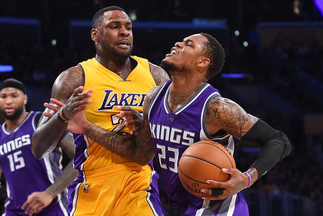 LOS ANGELES, CA - FEBRUARY 14:  Tarik Black #28 of the Los Angeles Lakers fouls Ben McLemore #23 of the Sacramento Kings as McLemore drives to the basket in the second half of the game at Staples Center on February 14, 2017 in Los Angeles, California. The Sacramento Kings won 97-96.NOTE TO USER: User expressly acknowledges and agrees that, by downloading and or using this photograph, User is consenting to the terms and conditions of the Getty Images License Agreement. (Photo by Jayne Kamin-Oncea/Getty Images)