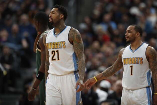 Denver Nuggets forward Wilson Chandler (21) and Denver Nuggets guard Jameer Nelson (1) in the second half of an NBA basketball game Friday, Feb. 3, 2017, in Denver. The Nuggets won 121-117. (AP Photo/David Zalubowski)
