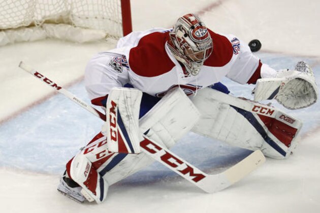Montreal Canadiens goalie Carey Price uses his shoulder to deflect a Colorado Avalanche shot during the third period of an NHL hockey game Tuesday, Feb. 7, 2017, in Denver. The Avalanche won 4-0. (AP Photo/David Zalubowski)