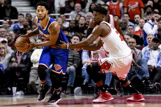 Chicago Bulls guard Jimmy Butler, right, defends as New York Knicks guard Derrick Rose (25) dribbles the ball during the second half of an NBA basketball game Friday, Nov. 4, 2016, in Chicago. (AP Photo/Matt Marton)