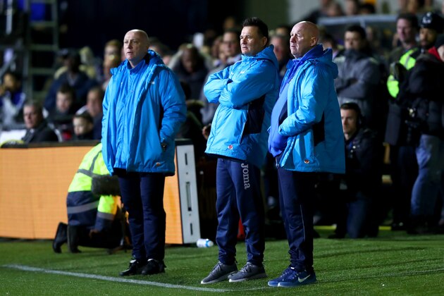 SUTTON, GREATER LONDON - FEBRUARY 20:  Paul Doswell, manager of Sutton United watches the action from the touchline next to his assistant Micky Stephens (L) and head coach Ian Baird during the Emirates FA Cup fifth round match between Sutton United and Arsenal on February 20, 2017 in Sutton, Greater London.  (Photo by Clive Rose/Getty Images)
