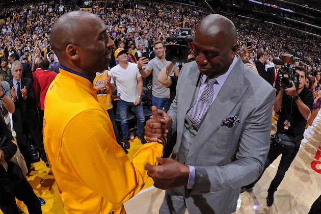 LOS ANGELES, CA - APRIL 13:  Kobe Bryant #24 of the Los Angeles Lakers hugs NBA Legend, Magic Johnson after he introduces him before his last game against the Utah Jazz on April 13, 2016 at Staples Center in Los Angeles, California. NOTE TO USER: User expressly acknowledges and agrees that, by downloading and/or using this Photograph, user is consenting to the terms and conditions of the Getty Images License Agreement. Mandatory Copyright Notice: Copyright 2016 NBAE (Photo by Andrew D. Bernstein/NBAE via Getty Images)