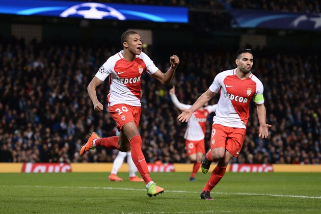 Monaco's French forward Kylian Mbappe Lottin (L) celebrates scoring their second goal during the UEFA Champions League Round of 16 first-leg football match between Manchester City and Monaco at the Etihad Stadium in Manchester, north west England on February 21, 2017. / AFP / Oli SCARFF        (Photo credit should read OLI SCARFF/AFP/Getty Images)