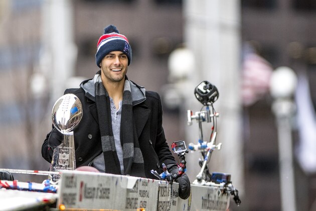 BOSTON, MA - FEBRUARY 07: Jimmy Garoppolo of the New England Patriots holds the Vince Lombardi trophy during the Super Bowl victory parade on February 7, 2017 in Boston, Massachusetts. (Photo by Billie Weiss/Getty Images)