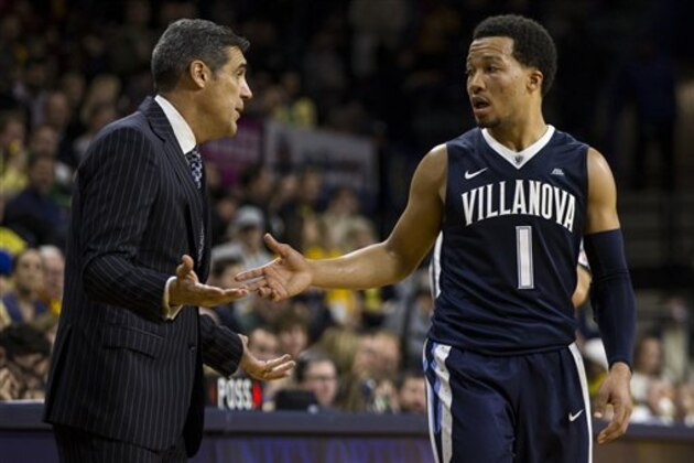 Villanova Wildcats head coach Jay Wright, left, talks with Jalen Brunson, right, during the second half of an NCAA basketball game against La Salle, Tuesday, Dec. 6, 2016, in Philadelphia. Villanova won 89-79. (AP Photo/Chris Szagola)