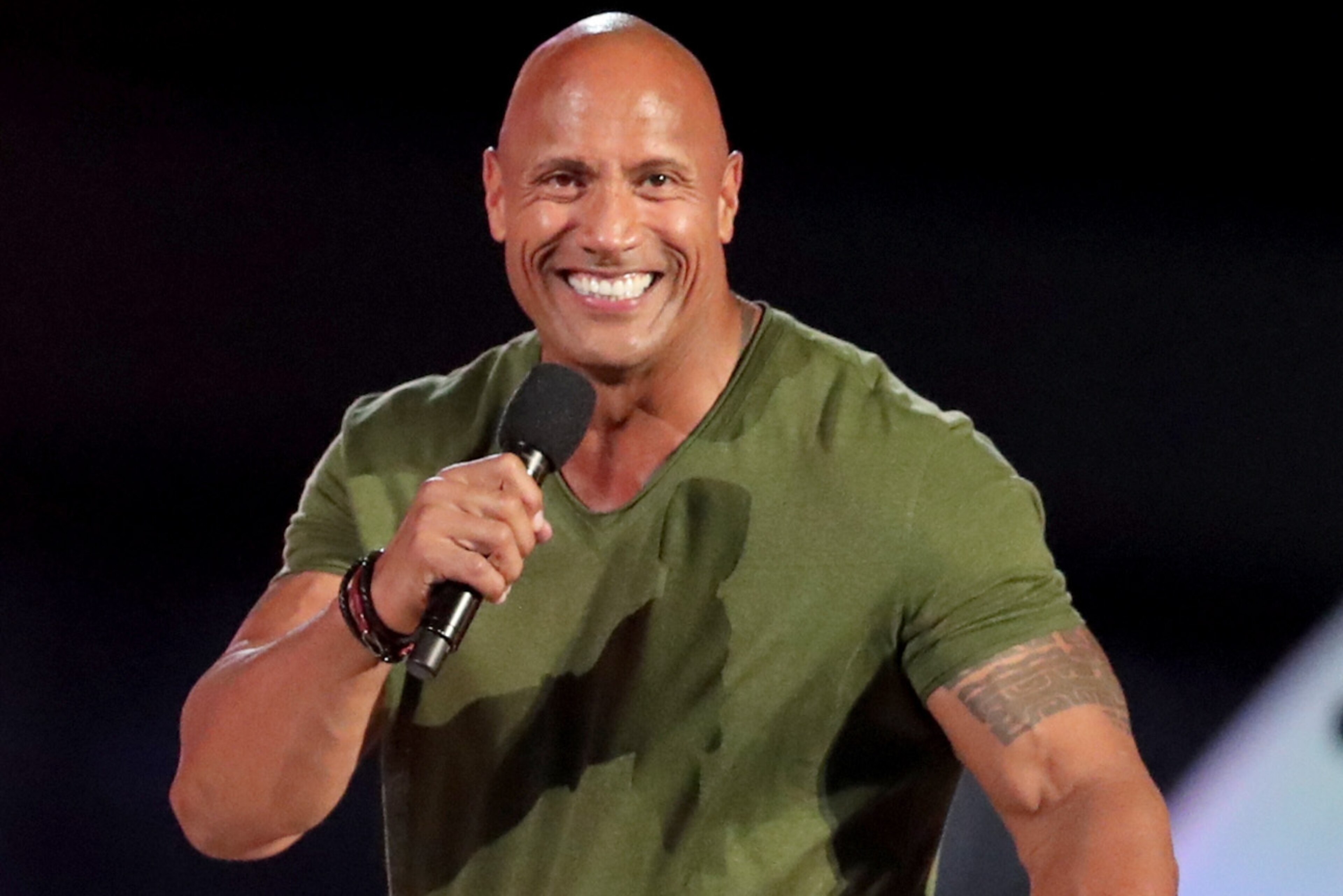 HONOLULU, HI - OCTOBER 22:  Dwayne 'The Rock' Johnson speaks onstage during 'Spike's Rock the Troops' event held at Joint Base Pearl Harbor - Hickam on October 22, 2016 in Honolulu, Hawaii. 'Spike's Rock the Troops' will premiere on December 13 at 9 PM, ET/PT on Spike.  (Photo by Christopher Polk/Getty Images for Spike)
