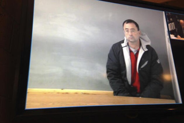 Dr. Larry Nassar appears during a video arraignment in Mason, Mich., Tuesday, Nov. 22, 2016. Nassar, a former USA Gymnastics team doctor, has pleaded not guilty to three counts of first-degree criminal sexual conduct in his Michigan home with a girl aged 6 to 12. Nassar was arrested Monday. (AP Photo/David Eggert)