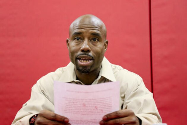 FILE- In this Aug. 19, 2016, file photo, Nebraska receivers coach Keith Williams reads a statement about his drunken driving arrest and suspension from coaching duties during an NCAA college football news conference at Hawks Championship Center in Lincoln, Neb. On Wednesday, Feb. 22, 2017, Williams was sentenced to 30 days in jail and fined $1,000 after pleading no contest to third-degree drunken driving. Williams is to report to jail on March 3, but a Lancaster County judge said Williams could apply for house arrest. Williams was arrested after rear-ending a vehicle in August, and Cornhuskers coach Mike Riley suspended him for the first four games of the 2016 season. (AP Photo/Nati Harnik, file)