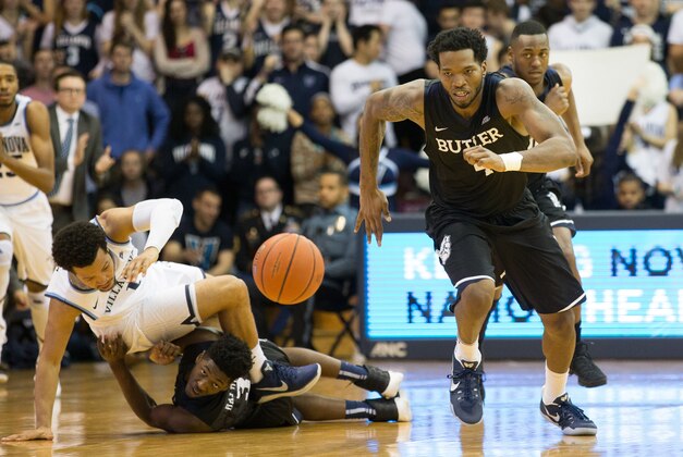 Feb 22, 2017; Villanova, PA, USA; Butler Bulldogs forward Tyler Wideman (4) chases down the ball after guard Kamar Baldwin (3) knocks it away from Villanova Wildcats guard Jalen Brunson (1) during the first half at The Pavilion. Mandatory Credit: Bill Streicher-USA TODAY Sports