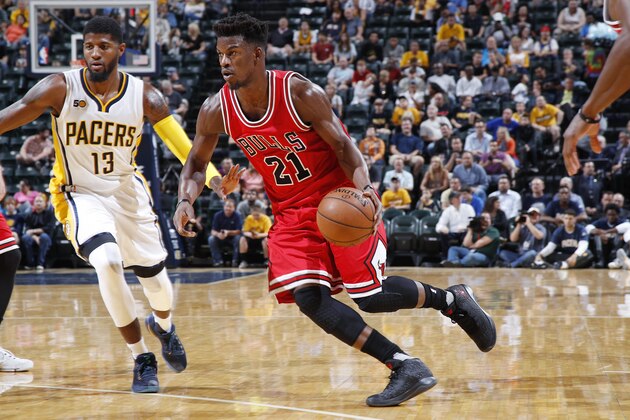 INDIANAPOLIS, IN - OCTOBER 06: Jimmy Butler #21 of the Chicago Bulls drives against Paul George #13 of the Indiana Pacers during a preseason game at Bankers Life Fieldhouse on October 6, 2016 in Indianapolis, Indiana. The Pacers defeated the Bulls 115-108. (Photo by Joe Robbins/Getty Images)
