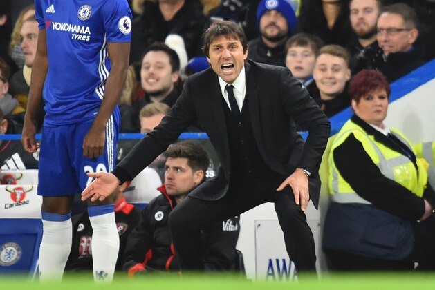 Chelsea's Italian head coach Antonio Conte gesture from the touchline during the English Premier League football match between Chelsea and Bournemouth at Stamford Bridge in London on December 26, 2016. / AFP / Glyn KIRK / RESTRICTED TO EDITORIAL USE. No use with unauthorized audio, video, data, fixture lists, club/league logos or 'live' services. Online in-match use limited to 75 images, no video emulation. No use in betting, games or single club/league/player publications.  /         (Photo credit should read GLYN KIRK/AFP/Getty Images)