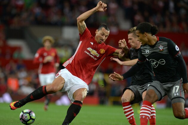 Manchester United's Swedish striker Zlatan Ibrahimovic (L) vies with Southampton's Northern Irish midfielder Steven Davis and Southampton's Dutch defender Virgil van Dijk (R) during the English Premier League football match between Manchester United and Southampton at Old Trafford in Manchester, north west England, on August 19, 2016. / AFP / Oli SCARFF / RESTRICTED TO EDITORIAL USE. No use with unauthorized audio, video, data, fixture lists, club/league logos or 'live' services. Online in-match use limited to 75 images, no video emulation. No use in betting, games or single club/league/player publications.  /         (Photo credit should read OLI SCARFF/AFP/Getty Images)