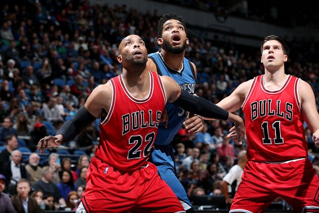 MINNEAPOLIS, MN - FEBRUARY 12: Karl-Anthony Towns #32 of the Minnesota Timberwolves fights for the position against Taj Gibson #22 and Doug McDermott #11 of the Chicago Bulls on February 12, 2017 at Target Center in Minneapolis, Minnesota. NOTE TO USER: User expressly acknowledges and agrees that, by downloading and or using this Photograph, user is consenting to the terms and conditions of the Getty Images License Agreement. Mandatory Copyright Notice: Copyright 2017 NBAE (Photo by David Sherman/NBAE via Getty Images)