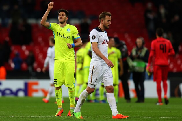 LONDON, ENGLAND - FEBRUARY 23: A dejected Harry Kane of Tottenham Hotspur walks off as Rami Gershon of KAA Gent celebrates the win after the UEFA Europa League Round of 32 second leg match between Tottenham Hotspur and KAA Gent at Wembley Stadium on February 23, 2017 in London, United Kingdom. (Photo by Catherine Ivill - AMA/Getty Images)